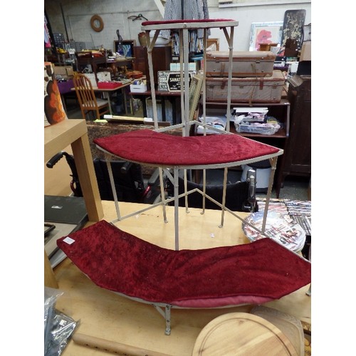 432 - WHITE METAL CORNER DISPLAY STAND, WITH 3 RED VELVET CURVED TIERS.