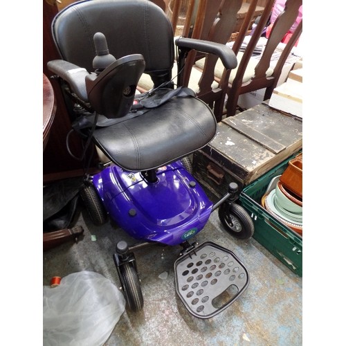 447 - MODERN MOTORISED CARE-CO WHEELCHAIR. WITH CONTROL PAD AND BATTERY CHARGER. COBALT BLUE BODY.