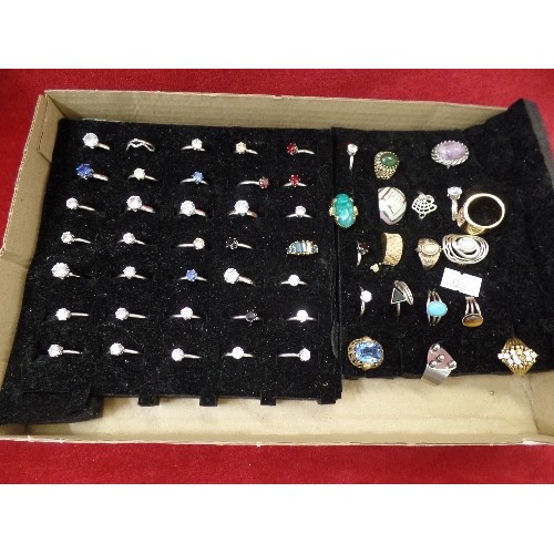 66 - COSTUME JEWELLERY. 55 X DRESS RINGS. MIXED STYLES.  ON BLACK DISPLAY PAD.