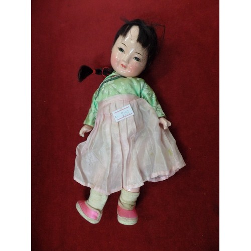 67 - SMALL VINTAGE ORIENTAL DOLL, IN TRADITIONAL DRESS. LIMBS & HEAD ARE LOOSE.