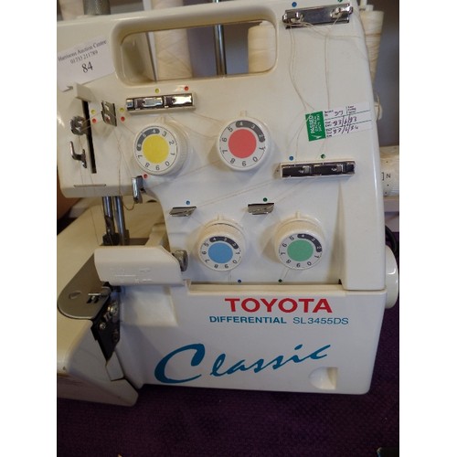 84 - TOYOTA OVERLOCKING/SEWING MACHINE. CLASSIC DIFFERENTIAL SL 3455DS. HOLDS 4 X LARGE SPOOLS. WORKING