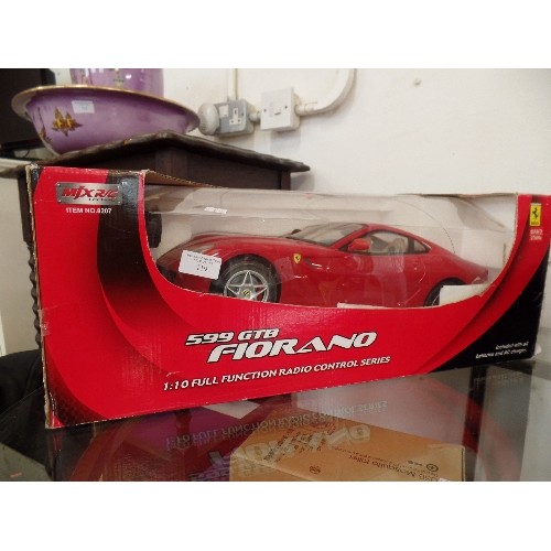 119 - FERRARI. LARGE RADIO-CONTROLLED 599 GTB FIORANO. 1:10 FULL FUNCTION SERIES. BOXED.