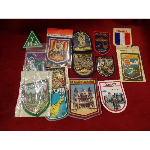 132 - COLLECTION OF VINTAGE SOUVENIR CLOTH BADGES. MANY STILL PACKAGED.