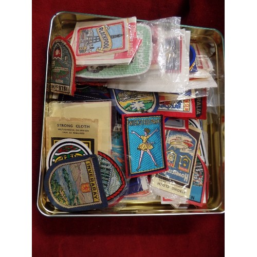 132 - COLLECTION OF VINTAGE SOUVENIR CLOTH BADGES. MANY STILL PACKAGED.