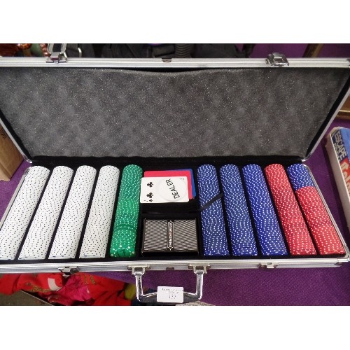 137 - CASINO CASE, FULL OF POKER CHIPS. ALSO 2 BOXES OF PLAYING CARDS.