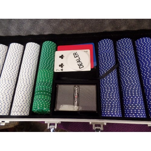 137 - CASINO CASE, FULL OF POKER CHIPS. ALSO 2 BOXES OF PLAYING CARDS.