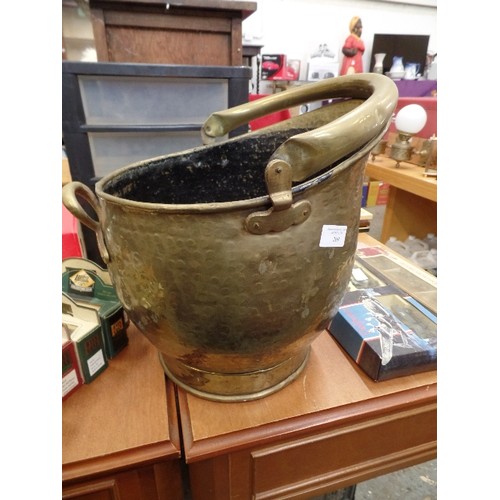 269 - LARGE POT BELLY COAL SCUTTLE. HAMMERED BRASS.