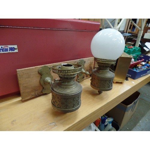 277 - PAIR OF BRASS OIL LAMPS ON WOODEN WALL MOUNT. 1 HAS MILK GLASS GLOBE, 1 MISSING.