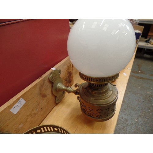 277 - PAIR OF BRASS OIL LAMPS ON WOODEN WALL MOUNT. 1 HAS MILK GLASS GLOBE, 1 MISSING.