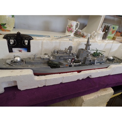 87 - RADIO CONTROLLED MODEL BATTLESHIP HT-2879F. WITH REMOTE CONTROL UNIT. 79CM L.