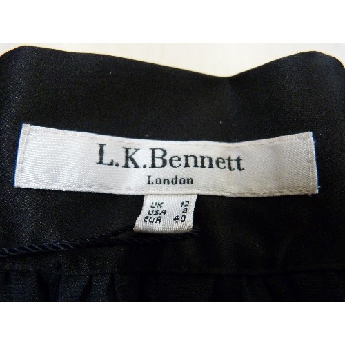 214 - LK.BENNETT NEW/WITH TAGS. BLACK CREPE EVENING SKIRT WITH SATIN BORDER/WAIST. SIZE 12, PLEATED. MID-L... 