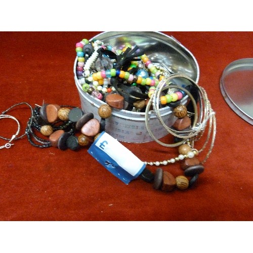 248 - TIN OF MIXED COSTUME JEWELLERY.