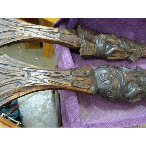 95 - LARGE WALL-HANGING CARVED WOODEN FORK AND SPOON. DECORATED WITH ORIENTAL ELDER FIGURES.