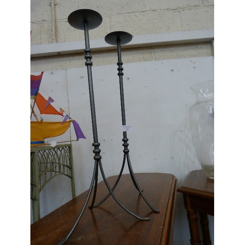 132 - PAIR OF TALL GREY METAL CANDLE HOLDERS. WITH SPIKE FOR PILLAR CANDLE. 57CMH.