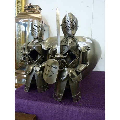 136 - PAIR OF TIN-PLATE WINE BOTTLE COVERS. KNIGHTS IN SHINING ARMOUR.