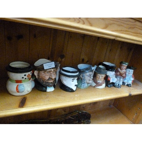 395 - COLLECTION OF 8 SMALL TOBY JUGS. INCLUDES WINSTON CHURCHILL, OLIVER TWIST, CHARLIE CHAPLIN, A PIRATE... 