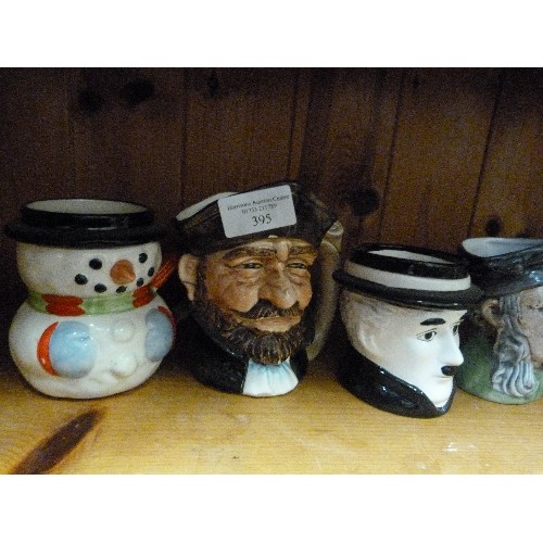 395 - COLLECTION OF 8 SMALL TOBY JUGS. INCLUDES WINSTON CHURCHILL, OLIVER TWIST, CHARLIE CHAPLIN, A PIRATE... 