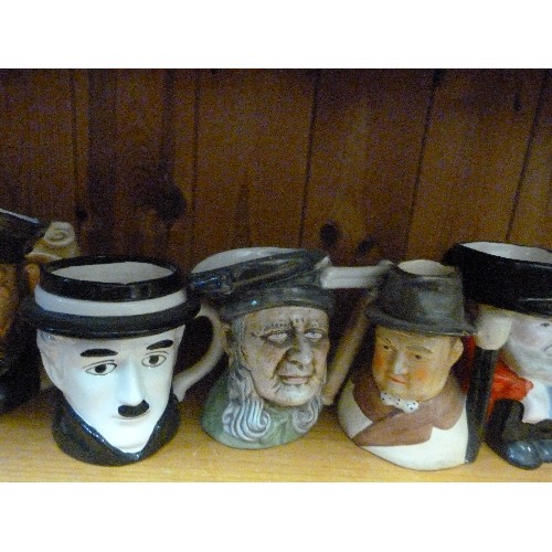 395 - COLLECTION OF 8 SMALL TOBY JUGS. INCLUDES WINSTON CHURCHILL, OLIVER TWIST, CHARLIE CHAPLIN, A PIRATE... 