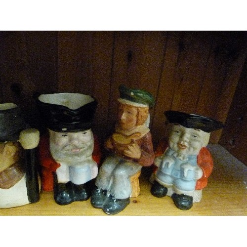 395 - COLLECTION OF 8 SMALL TOBY JUGS. INCLUDES WINSTON CHURCHILL, OLIVER TWIST, CHARLIE CHAPLIN, A PIRATE... 