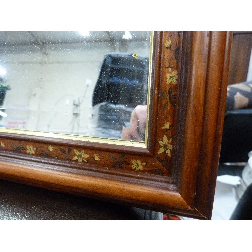 413 - BEVELLED WALL MIRROR WITH FLORAL WOODEN FRAME.