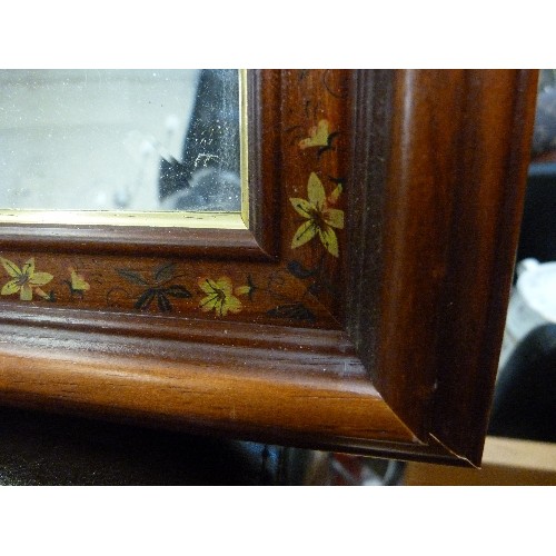 413 - BEVELLED WALL MIRROR WITH FLORAL WOODEN FRAME.