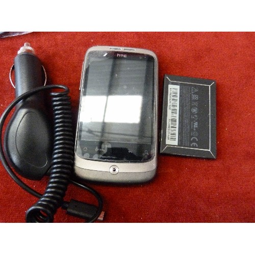 94 - HTC MOBILE PHONE. WITH ANDROID CAMERA ATTACHMENT, AND OTHER CABLES AND ATTACHMENTS.