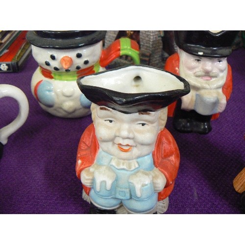 78 - COLLECTION OF 8 SMALL TOBY JUGS. INCLUDES WINSTON CHURCHILL, OLIVER TWIST, CHARLIE CHAPLIN, A PIRATE... 