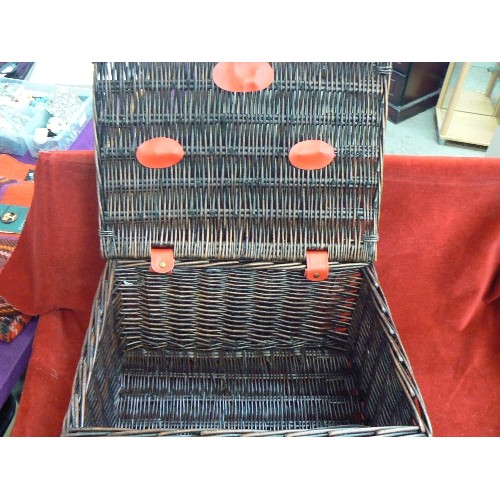 94 - SMALL M&S HAMPER. DARK BROWN WICKER WITH RED STRAPS ETC.