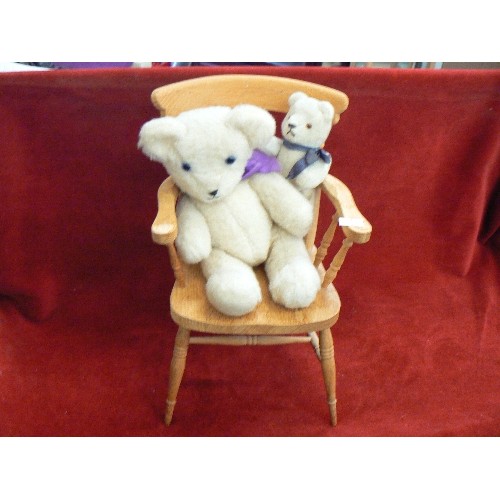 97 - 2 SMALL JOINTED BEARS ON A WOODEN WINDSOR CHAIR.