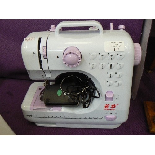 107 - SMALL PORTABLE ELECTRIC SEWING MACHINE. FHSM-505[A] WITH CARRY HANDLE.