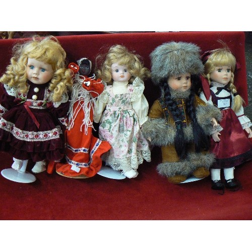 126 - 7 X COLLECTABLE PORCELAIN DOLLS. INC A LOVELY HUNTER/BEAR CATCHER DOLL IN TRADITIONAL ESKIMO FUR HAT... 