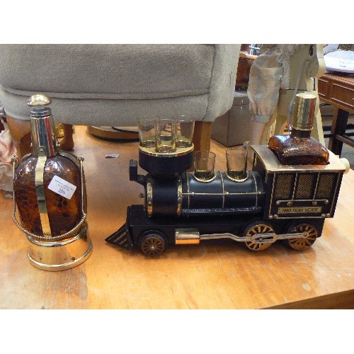 250 - 2 X RETRO-VINTAGE AMBER GLASS/BRASS MUSICAL DECANTERS. ONE IN THE STYLE OF LOCOMOTIVE '1880 IRON HOR... 