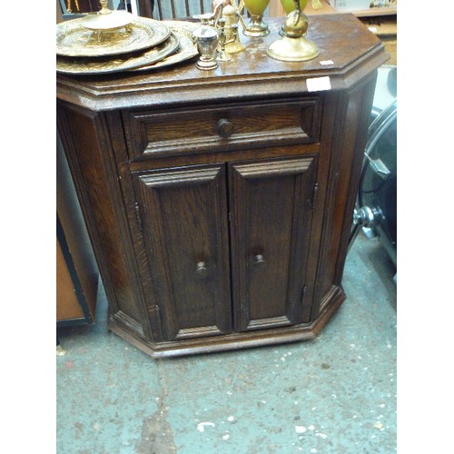 293 - SMALL VINTAGE DARK OAK CABINET WITH CUT CORNERS,  DRAWER AT TOP AND 2 DOOR SHELVED CABINET. 65CMW