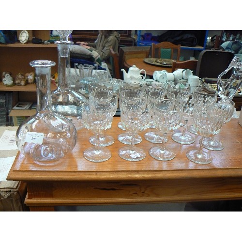 295 - 2 CONTEMPORARY GLASS DECANTERS, WITH 14 MATCHING WINE GLASSES