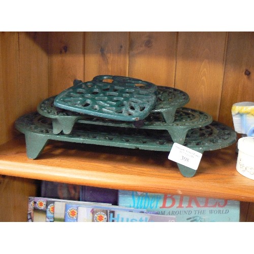 308 - 4 X DARK GREEN CAST TRIVETS.