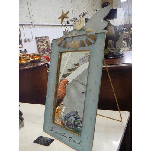 193 - NOVELTY TIN-PLATE MIRROR. MODERN ANGEL FIGURE LEANING OVER THE TOP WITH THE WORDING 'BEAUTIFUL'