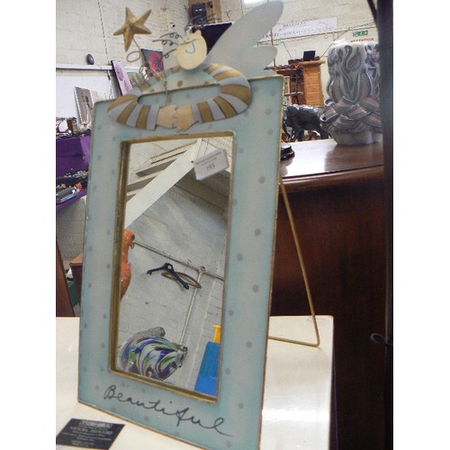 193 - NOVELTY TIN-PLATE MIRROR. MODERN ANGEL FIGURE LEANING OVER THE TOP WITH THE WORDING 'BEAUTIFUL'