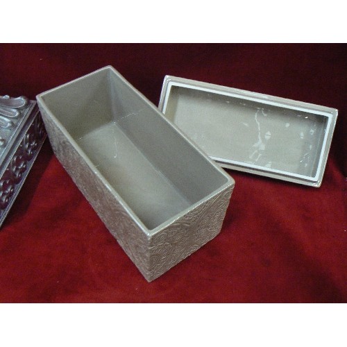 266 - 2 X CONTEMPORARY LIDDED BOXES. A CERAMIC WITH EMBOSSED GLAZE, AND A SILVER RESIN.