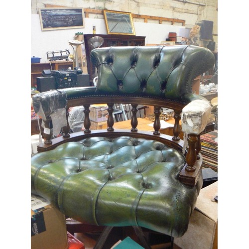 273 - DARK GREEN CAPTAINS CHAIR. LEATHER BUTTONED SEAT AND BACK. SWIVEL BASE ON CASTORS.