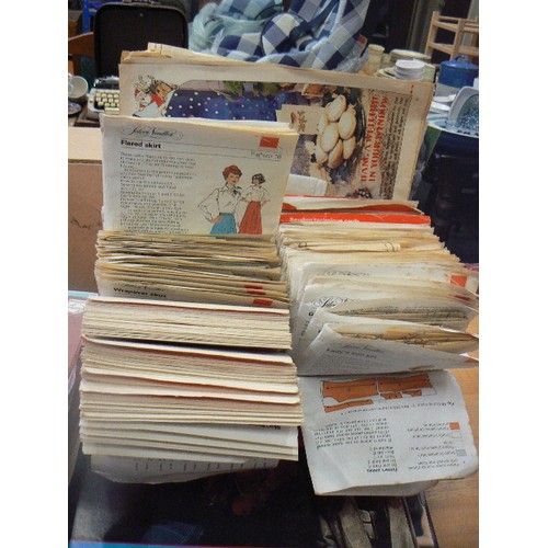 301 - QUANTITY OF VINTAGE SILVER NEEDLES SEWING PATTERNS. IN RETRO ORANGE PLASTIC SILVER NEEDLES CASE.