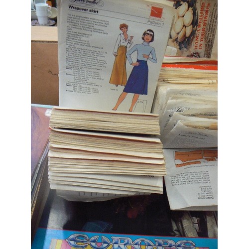 301 - QUANTITY OF VINTAGE SILVER NEEDLES SEWING PATTERNS. IN RETRO ORANGE PLASTIC SILVER NEEDLES CASE.