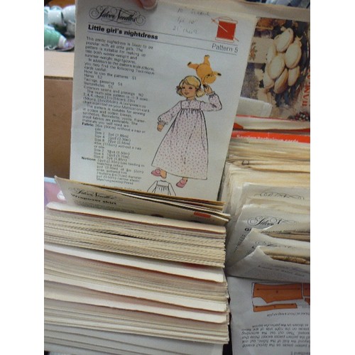 301 - QUANTITY OF VINTAGE SILVER NEEDLES SEWING PATTERNS. IN RETRO ORANGE PLASTIC SILVER NEEDLES CASE.