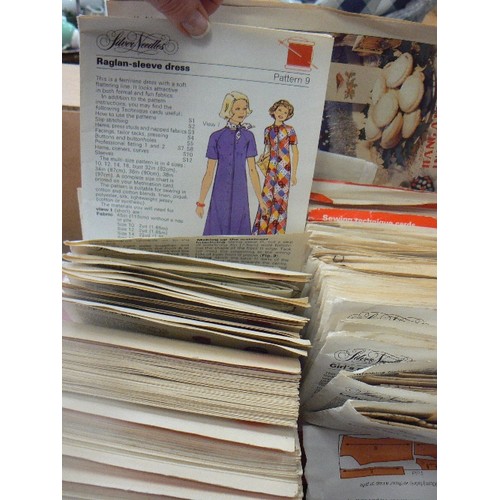 301 - QUANTITY OF VINTAGE SILVER NEEDLES SEWING PATTERNS. IN RETRO ORANGE PLASTIC SILVER NEEDLES CASE.