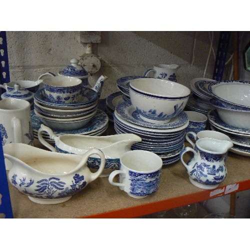 481 - LARGE QUANTITY OF BLUE AND WHITE CHINA INCLUDING WILLOW TREE, PLATES, BOWLS, TEAPOT, MILK JUGS ETC (... 