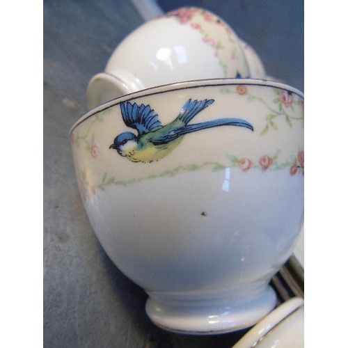 191 - AN EDWARDIAN TEASET BY TUSCAN CHINA DECORATED WITH SWALLOWS AND PINK ROSES - 36 PIECES. 1 OR 2 HAIRL... 