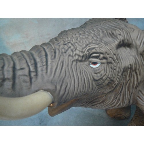 223 - A SUPERB LARGE PORCELAIN FIGURE OF AN ELEPHANT WITH TRUNK RAISED - MATT GLAZE FINISH - 45CM X 38CM