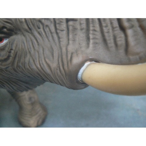 223 - A SUPERB LARGE PORCELAIN FIGURE OF AN ELEPHANT WITH TRUNK RAISED - MATT GLAZE FINISH - 45CM X 38CM