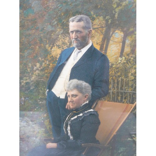 166 - A VERY GOOD EDWARDIAN ENHANCED PHOTOGRAPHIC PORTRAIT OF A COUPLE IN A GARDEN HIGHLIGHTED WITH OIL PA... 