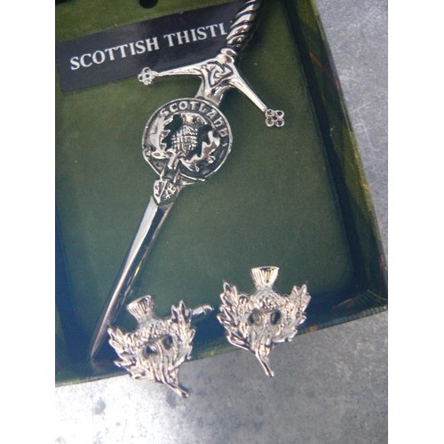 104 - A SCOTTISH THISTLE KILT BROOCH WITH MATCHING CUFFLINKS