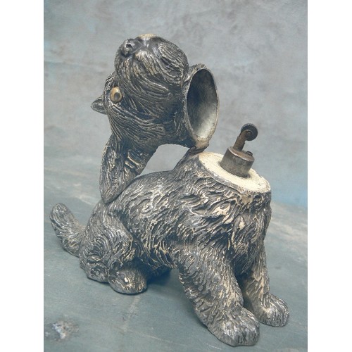 75A - A CIRCA 1920'A SPELTER SCOTTIE DOG TABLE LIGHTER WITH GLASS EYES - 17CM H